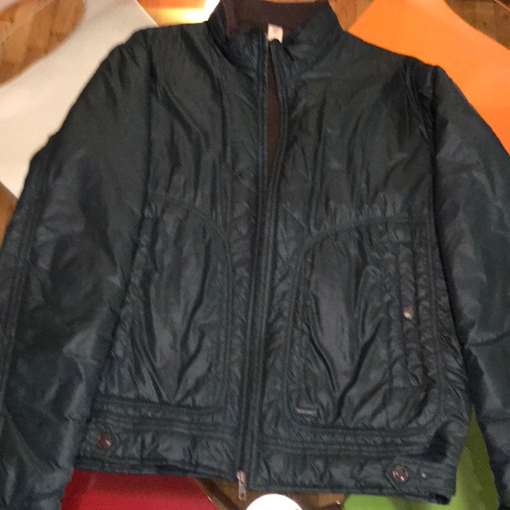 Diesel rain jacket with hide away hood.
